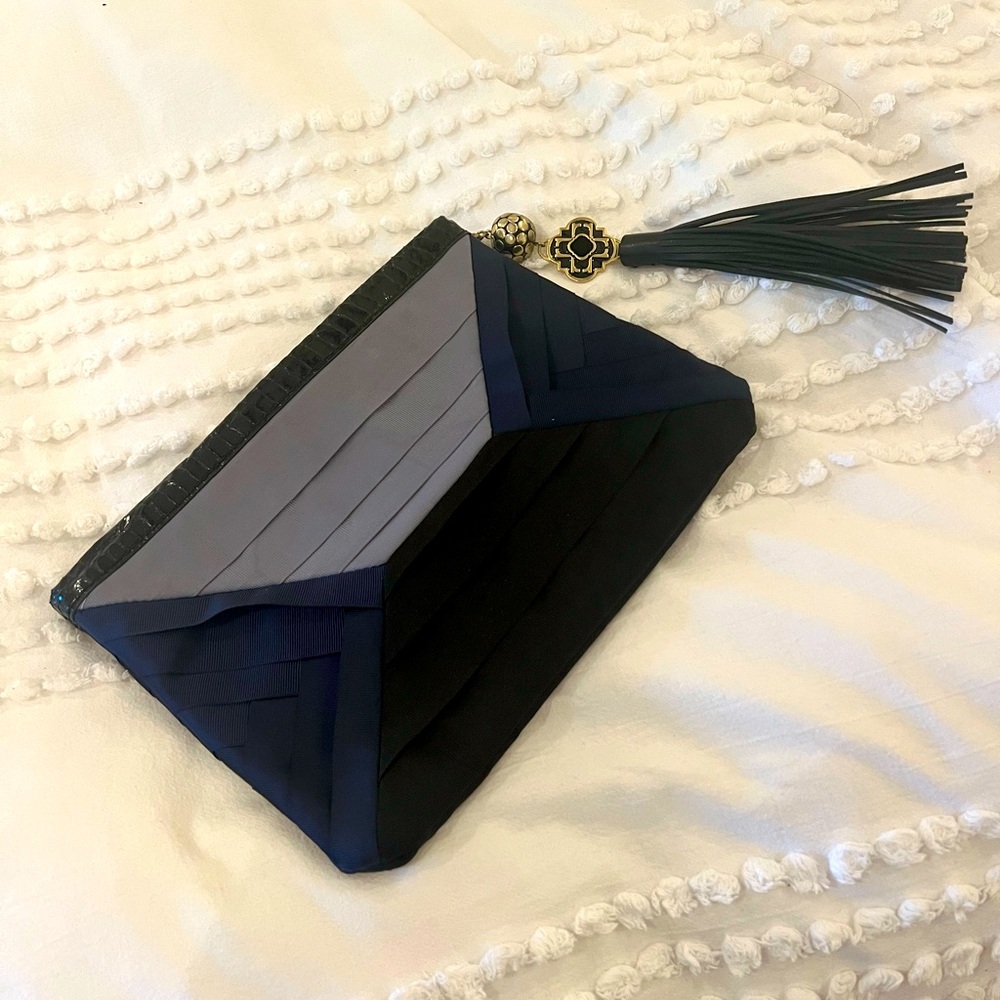 Auth RAFE clutch. Navy satin with leather tassel and trim